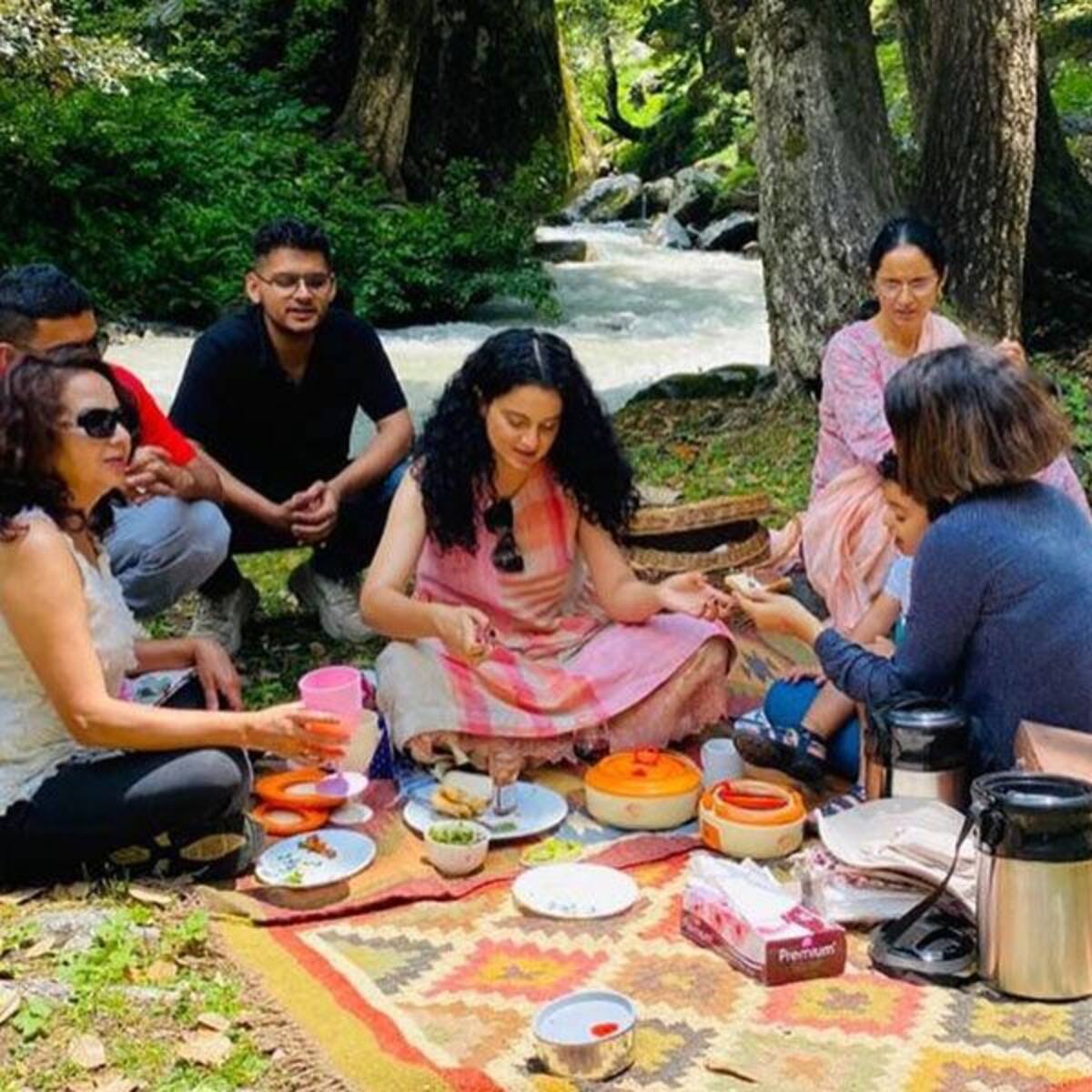 Kangana Ranaut And Sister Rangoli Chandel Take Their Family On A Beautiful Hilltop Picnic View Pics | our family is hosting traditional pahadi dham for the newly wed karan and anjali today, anjali can be seen in traditional attire, sharing. kangana ranaut and sister rangoli