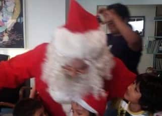 Aamir Khan as Santa with kids during Christmas party