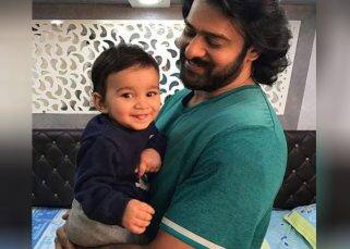 Baahubali actor Prabhas holding a toddler in this picture is breaking the internet- view pic