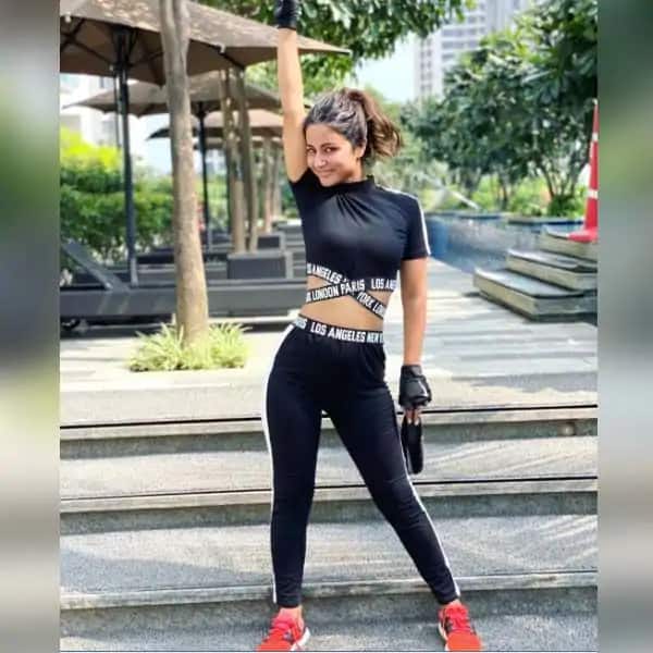 Image result for hina khan in black gym outfit in stairs