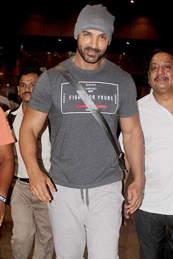 John Abraham & Priya Runchal snapped at the airport