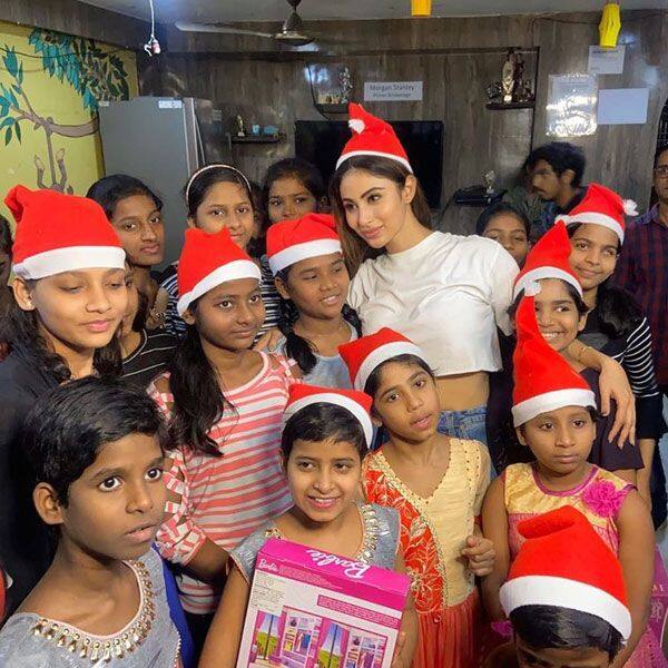 Simple Chic Mouni Roy Soaks In The X Mas Spirit As She Enjoys A Party With Children View Pics Photogallery At Bollywoodlife Com mouni roy soaks in the x mas spirit