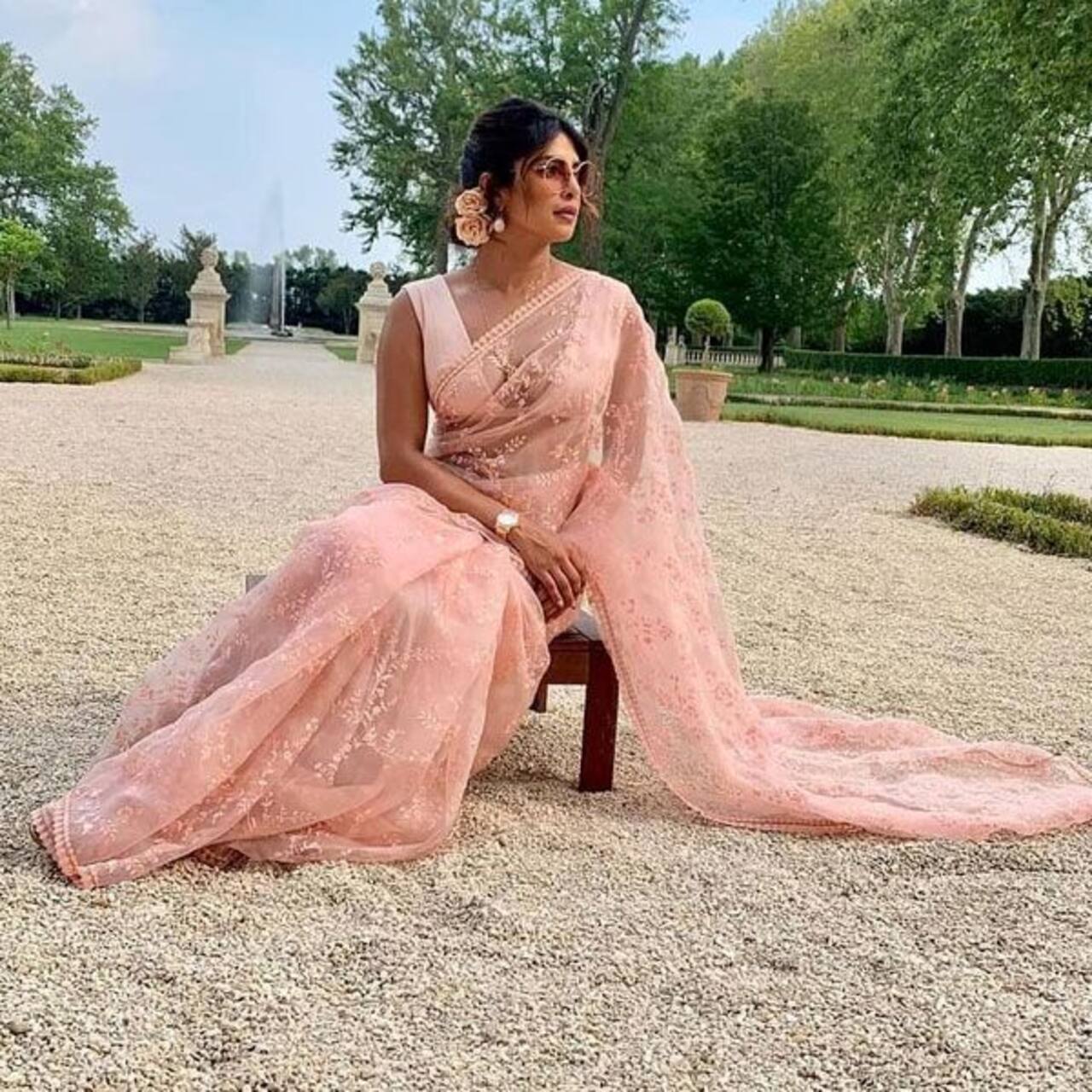 Priyanka Chopra looks effortlessly elegant in a pink chiffon saree