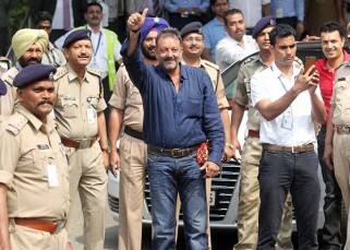 Sanjay Dutt greeting the media at airport